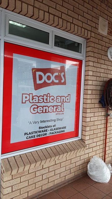 Doc's Plastic and General's distinctive red shopfront window in Port Shepstone